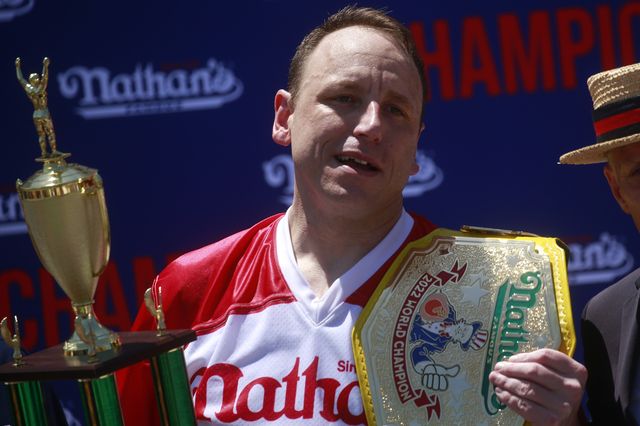 Joey Chestnut reacts after winning first place, eating 63 hot dogs in 10 minutes.